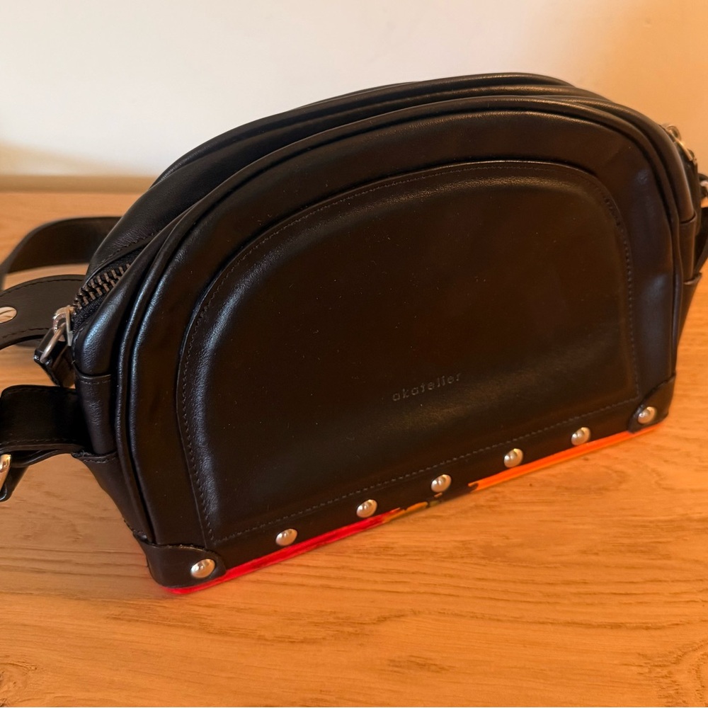 Chic Black Mini Bag with Red Accents